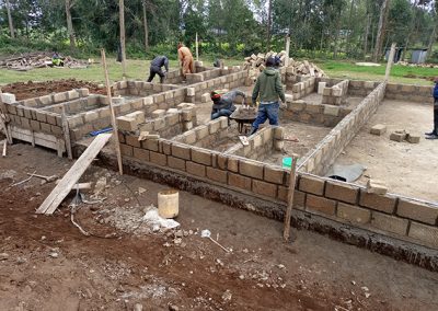 Cinder block walls being constructed on a new Kindergarten complex for Our Lady of Grace School Kenya